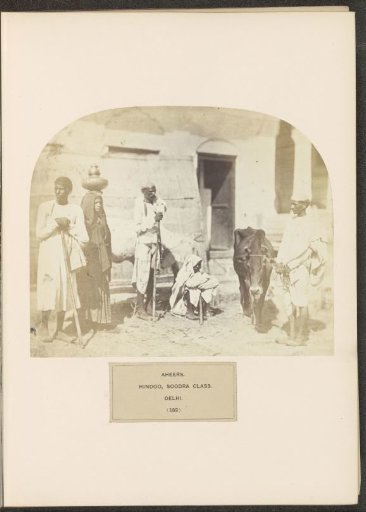 Five People in a Courtyard with Cows from the Ahir Community in Delhi, India