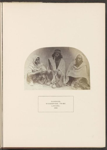 Portrait of three unknown people with a hookah from the Sansi community of Lahore, Punjab, Pakistan