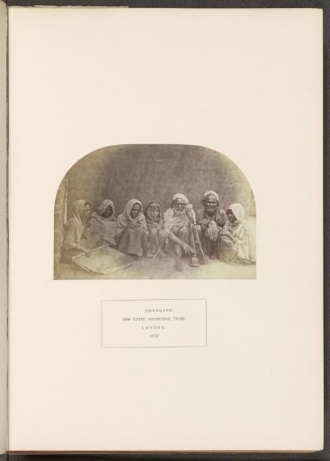 Group of seven squatted people from the Changar tribe of Lahore, Punjab, Pakistan