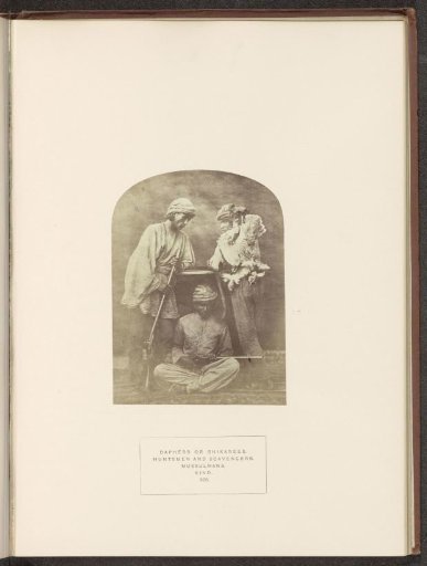 Portrait of three unknown hunters from Sindh, Pakistan, with a dead bird and rifles