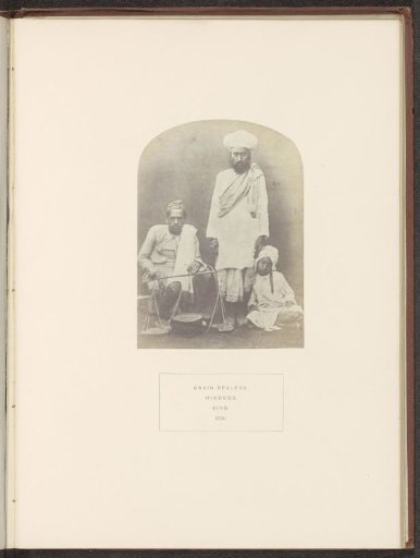 Portrait of three unknown grain dealers in Sindh, Pakistan