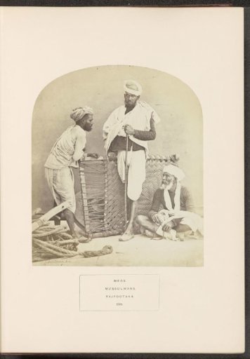 Portrait of three unknown men from the Meo community in front of a charpai, Rajasthan, India