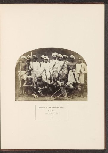 Group portrait of warriors from the Bhil tribe of Malwa, Madhya Pradesh, India