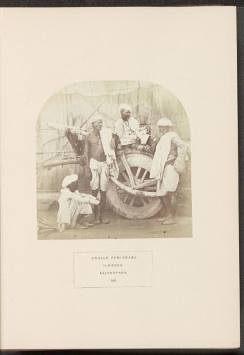 Portrait of four landowners (zamindars) from the Gujjar community by a wooden cart, India
