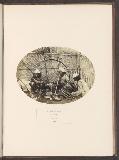 Three blacksmiths at work in Chennai, Tamil Nadu, India