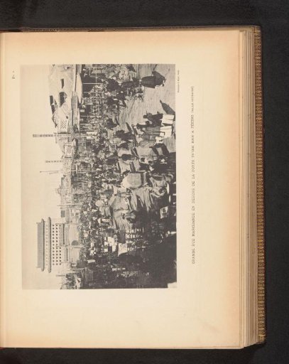 View of a busy shopping street at the Tsien-men gate in Peking