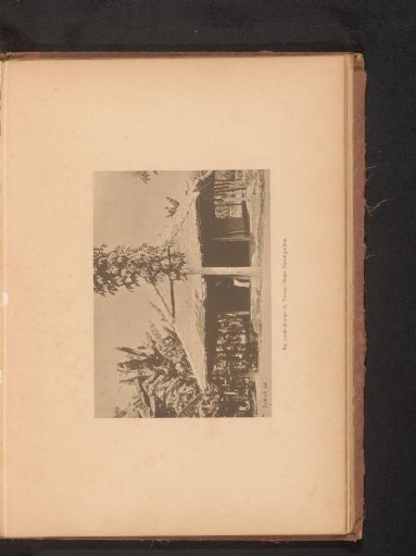 View of Four Unknown Persons Sitting in Front of a Dwelling
