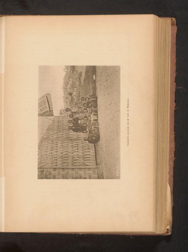 Group portrait of unknown women in front of a building