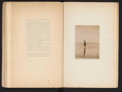View of an Unknown Woman Walking into the Sea
