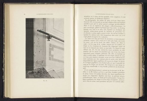Blood spatters on a wall above a staircase