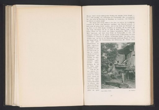 View of a Man with Cattle Near a House in South Tyrol