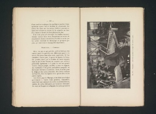 Men cutting printed playing cards in a printing house in Turnhout