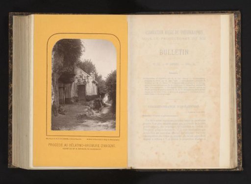 Two unknown children in front of a house