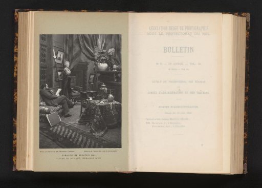 Unknown man reading a book in a room