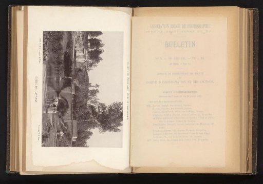 View of an unknown man and woman with a cow at a bridge