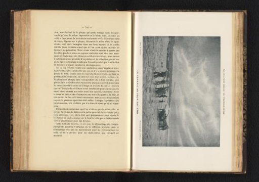 Unknown men pulling a boat onto land