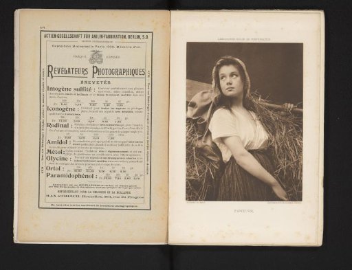 Woman with a Pitchfork Full of Straw on Her Shoulder
