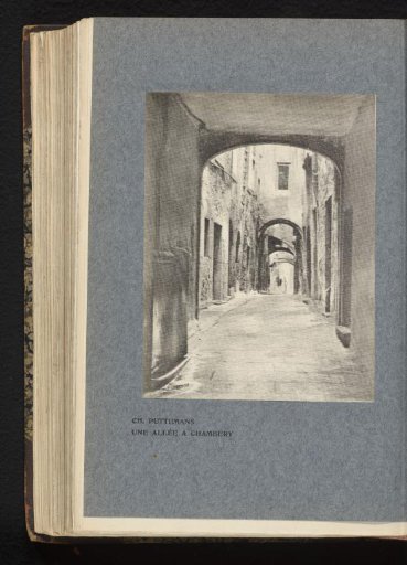 View of an alley through a gate