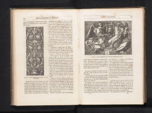 Reproduction of a heliogravure of an etching of two angels with the head of Christ by Albrecht Dürer