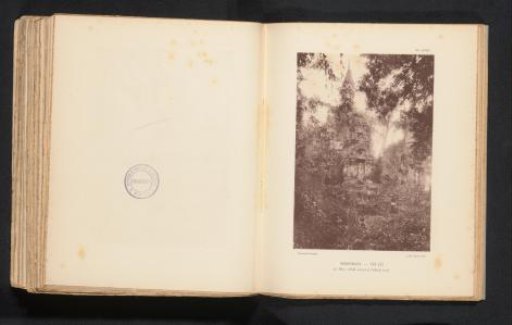 Unknown men before a temple in a forest