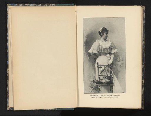 Portrait of an unknown woman behind a chair holding a fan