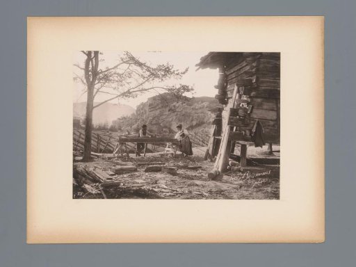 View of a Woman and a Man at a Saw Table in Switzerland