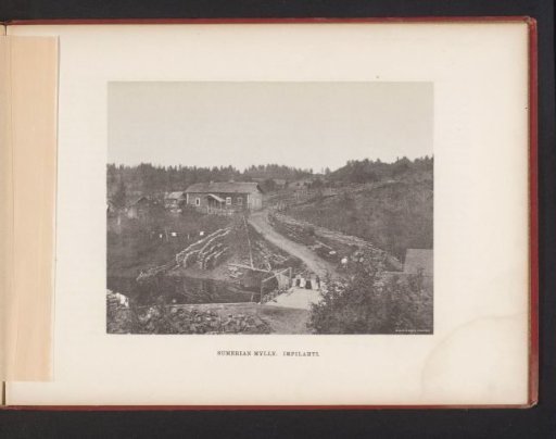 View of a path through a hilly landscape with houses