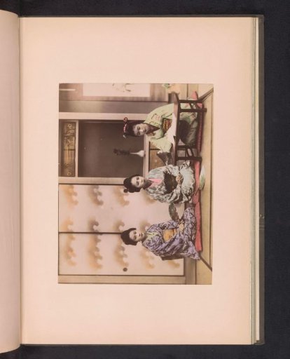 Three seated geishas in an interior