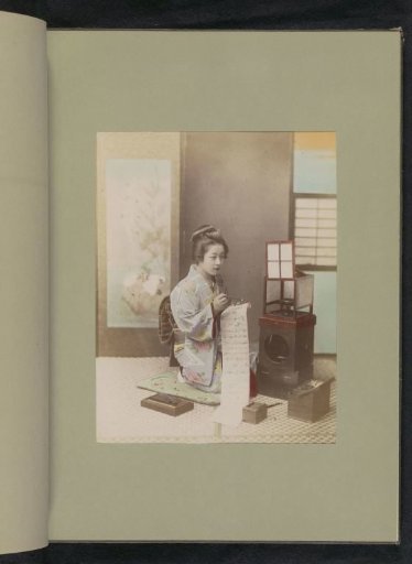 Woman writing a letter in an interior