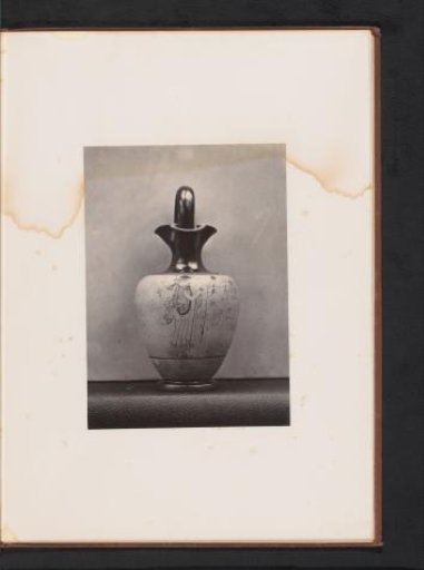 Oenochoë with a figure of a spinning woman