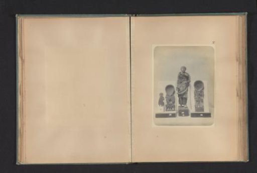 Four Egyptian objects, including the handle of a wooden spoon, a wooden spoon with two figures of Bes, and a wooden sculpture