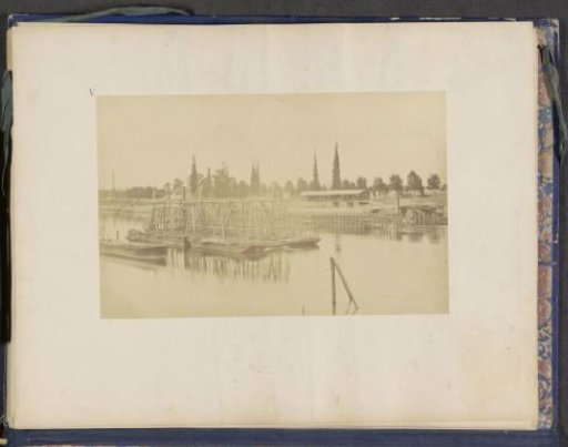 View of a wooden structure for the construction of the Viaduc d'Auteuil over the Seine at Point-du-Jour