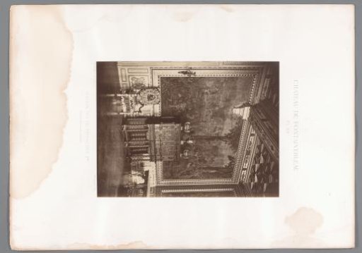 View of a wall with decorations and various furniture in the Salon François Ier of the Château de Fontainebleau, France
