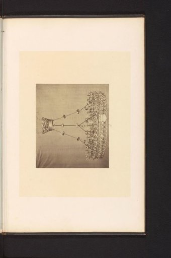 Two metal candlesticks with pedestals, displayed at an exhibition of religious objects from the Middle Ages and Renaissance in Mechelen in 1864