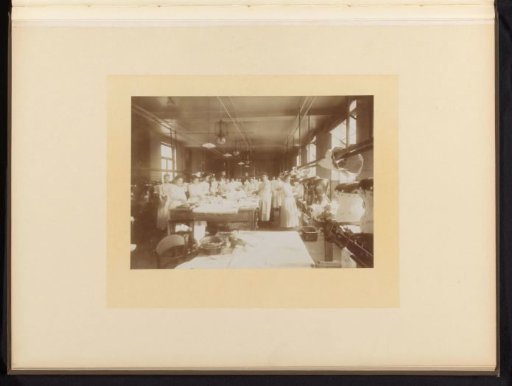 Interior of a corset factory with workers
