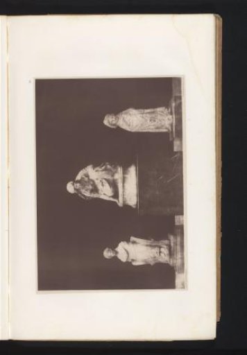 Three terracotta sculptures of a seated woman, a kneeling woman, and an actor