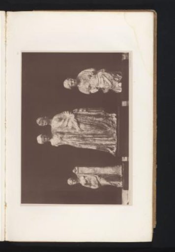 Three terracotta sculptures of a woman, two women, and an old woman