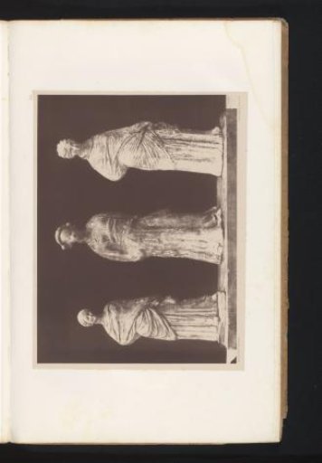 Three terracotta sculptures of a woman, a priestess of Bacchus, and a woman