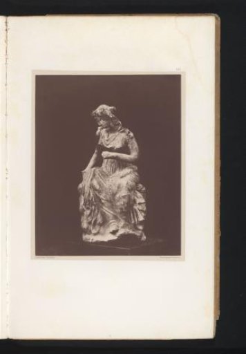 Terracotta sculpture of a seated woman