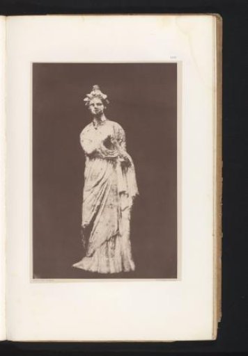 Terracotta sculpture of a woman with a floral wreath on her head