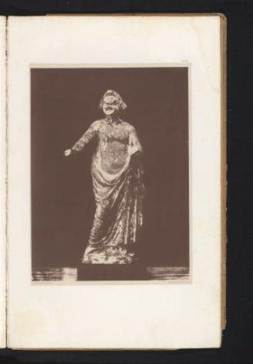 Terracotta sculpture of an actor with a mask
