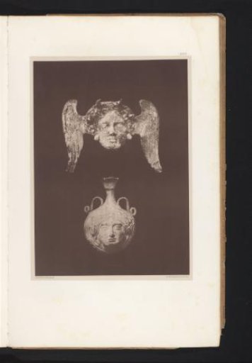 Terracotta sculpture of the head of Medusa with wings and a terracotta vase with the face of Medusa