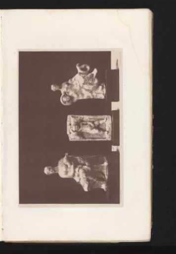 Three terracotta sculptures of a seated Diana, a sleeping child in a cradle, and Thetis