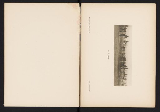 Group of people watching sailing ships at sea from the beach