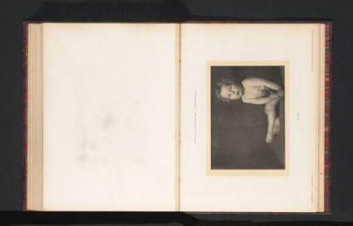 Seated nude child with a cup