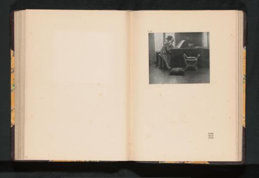 Seated woman playing the guitar