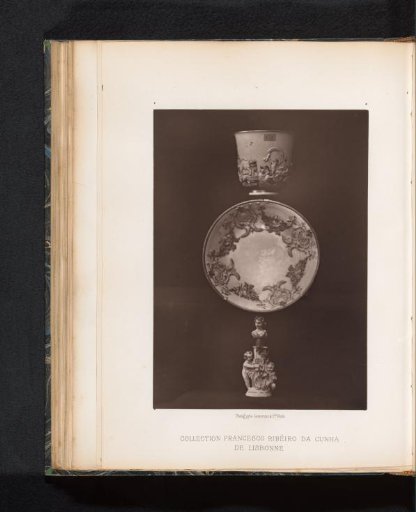 Cup and saucer with a perfume bottle