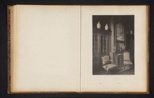 Room with a fireplace and two bookcases in the house of Antonin Terme