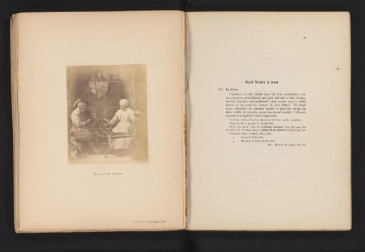 Photographic reproduction of a painting of a man and woman at the spinning wheel