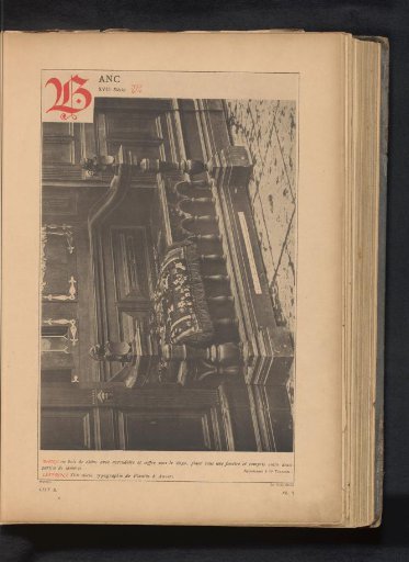 Wooden bench under a window with wainscoting